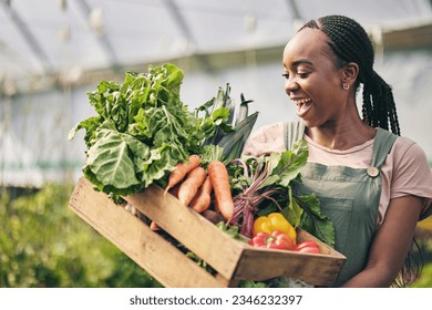 Woman, happy farmer and vegetables in greenhouse for agriculture, business growth and product in box. Excited African worker or supplier harvest and gardening with food, carrot and lettuce in basket - Powered by Shutterstock