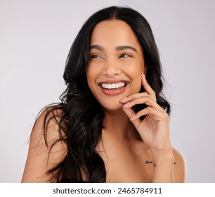 Woman, happy and hair care in studio with beauty for luxury salon treatment, shampoo and cosmetics. Girl, smile and confidence with healthy texture, transformation and growth for keratin treatment - Powered by Shutterstock