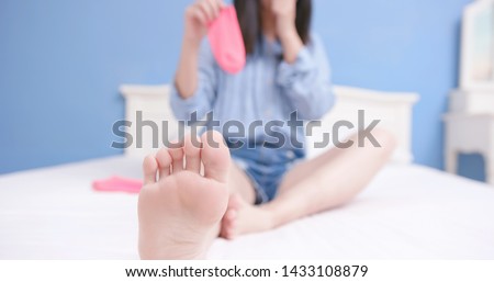 woman has athletes foot and she smells stinky socks