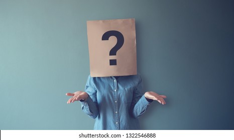 Woman Has Confused, Thinking, Question Mark Icon On Paper Bag, Copy Space.