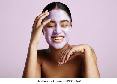 woman has fun with a facial mask