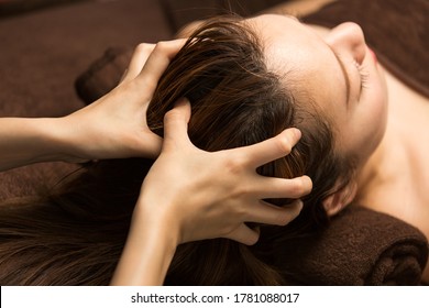 The woman has a head massage. - Shutterstock ID 1781088017