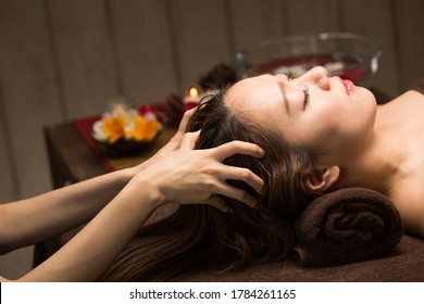 The Woman Has A Head Massage.