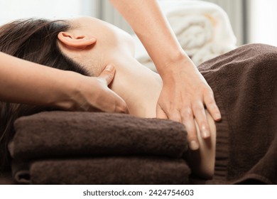 The woman has her neck massaged. - Powered by Shutterstock