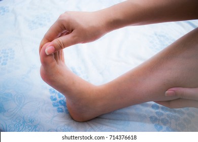 Woman Has Numbness On Her Right Foot. Cramp, Spasm, Twinge, Sprain