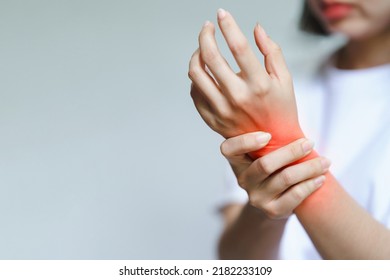 A woman has pain in her wrist. Health care concept.