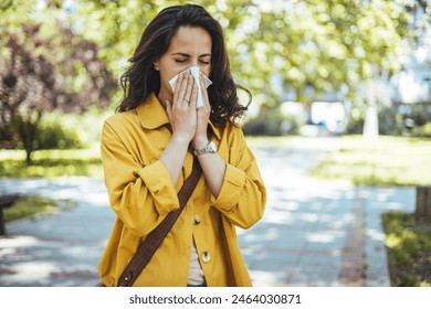 Woman has sneezing. Young woman is having flu and she is sneezing. Sickness, seasonal virus problem concept. Woman being sick having flu sneezing. - Powered by Shutterstock