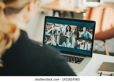 Woman Has Video Call With Her Remote Team Using Laptop And Camera