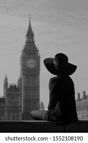 A Woman With A Hat Observes The Bigben