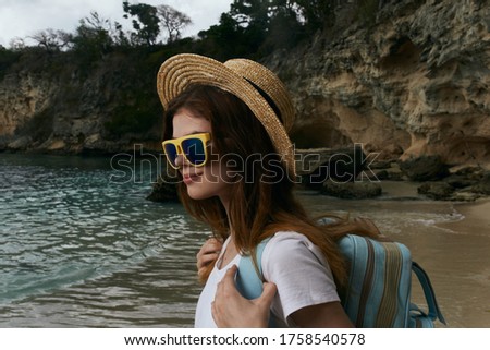 Woman in hat ocean island sunglasses