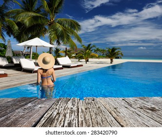 Woman In Hat At The Pool 