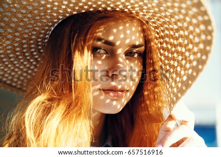 Similar – Young redhead woman covering from sun