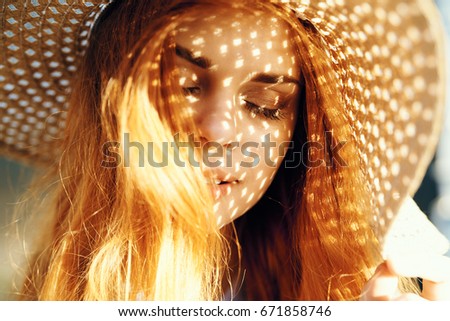 Similar – Young redhead woman covering from sun