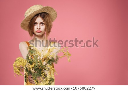 woman with hat, willow branch, yellow flowers                              