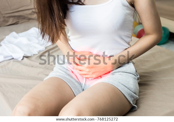 woman have bladder or uti pain with vaginal\
problem sitting on bed in bedroom after wake up feeling so\
illness,Woman Healthcare\
concept