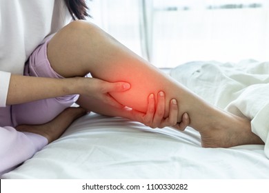 woman have a Calf leg pain and muscle leg pain,Healthcare concept - Shutterstock ID 1100330282