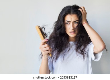 Woman have damaged and broken hair, loss hair, dry problem concept. - Shutterstock ID 2053913117