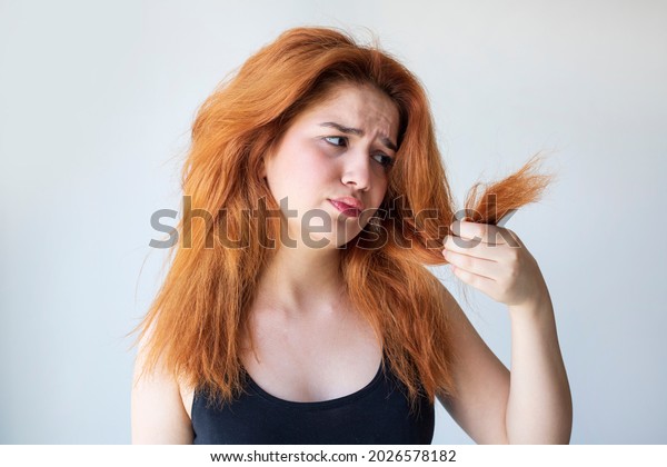 Woman have damaged and broken hair, loss hair,\
dry problem concept.