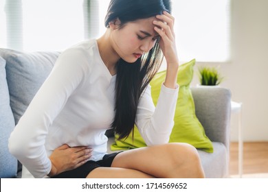 Woman Have A Stomach Pain From Menstruation At Home.