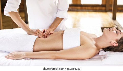 Woman Having Abdomen Massage.