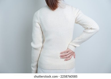 woman having back pain. Urinary system and Stones, Cancer, world kidney day, Chronic kidney stomach, liver pain and pancreas concept - Shutterstock ID 2258760585
