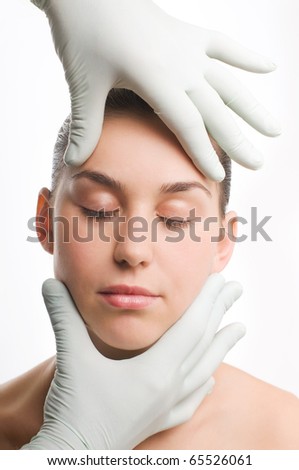 Woman having beauty treatment on face, plastic surgery