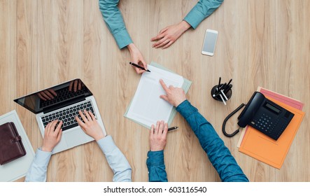 Woman Having A Business Meeting In The Office, She Is Signing A Contract, Top View