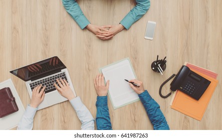 Woman Having A Business Meeting In The Office, A Man Is Showing Her A Contract And Giving Explanations, Top View