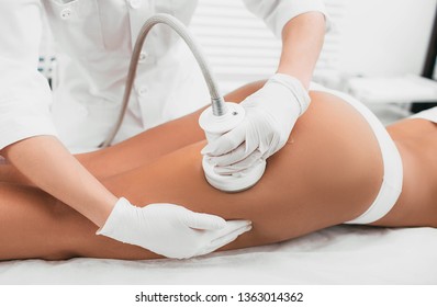 woman having cavitation, procedure removing cellulite on her buttocks , lifting buttocks