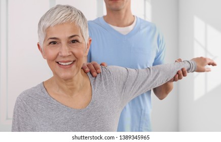 Woman having chiropractic back adjustment. Osteopathy, Physiotherapy, Injury rehabilitation concept - Powered by Shutterstock