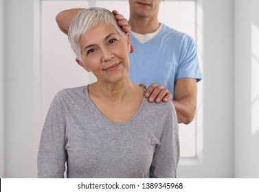 Woman Having Chiropractic Back Adjustment. Osteopathy, Physiotherapy, Injury Rehabilitation Concept