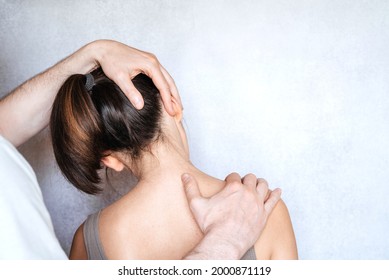 A Woman Having Chiropractic Neck Adjustment. Osteopathy, Kinesiology, Bad Posture Correction