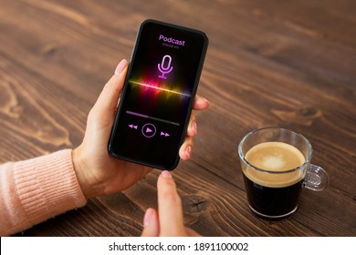 Woman Having Coffee And Listening To Podcast On Her Phone While