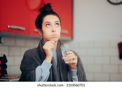 
Woman Having A Cold Taking Anti-viral Drug Treatment. Sick Person Feeling Unwell Deciding If To Take Pills Or Not 
