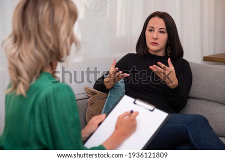 Woman having a conversation with a therapist