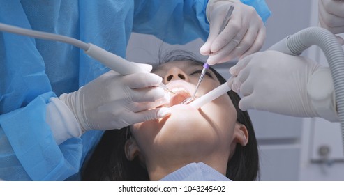 Woman Having Dental Check Up At Dental Clinic