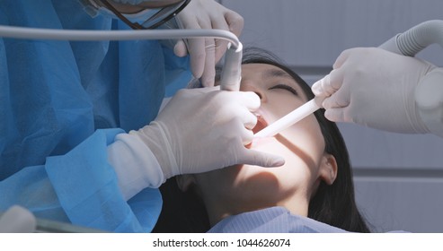 Woman Having Dental Check Up At Dental Clinic