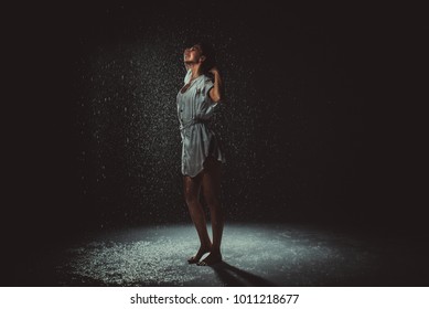 Woman having fun under the rain