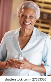 Woman Having A Glass Of Wine At A Bar