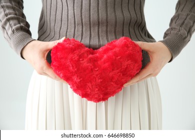 Woman Having A Heart Cushion