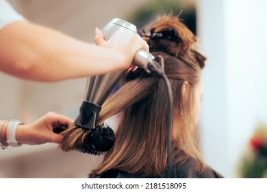 
				
				Woman Having her Hair Straighten with a Brush and a Hair Dryer. Hairdresser drying clients hair working with professional tools
				