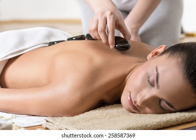 Woman Having Hot Stone Massage