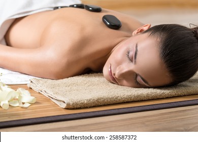 Woman Having Hot Stone Massage