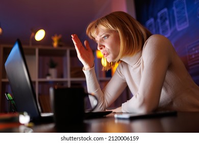 Woman Having Late Night Conference Call While Working Overtime In An Office, Anxious And Stressed Out In Work Related Conflict Situation