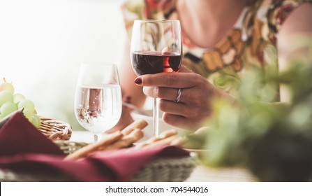 Woman Having Lunch At The Restaurant, She Is Taking A Glass Of Red Wine, Fine Dining And Lifestyle Concept