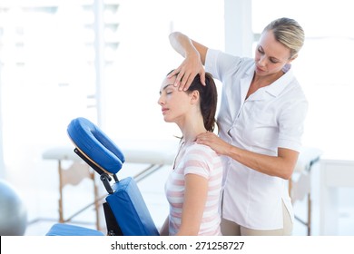 Woman having neck massage in medical office - Powered by Shutterstock