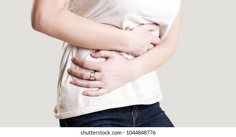 Woman having painful stomachache, chronic gastritis or abdomen bloating