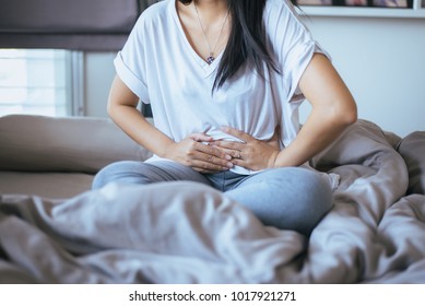 Woman having painful stomachache,Female suffering from abdominal,Pelvic pain