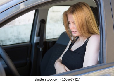 woman having a panic attack while driving
