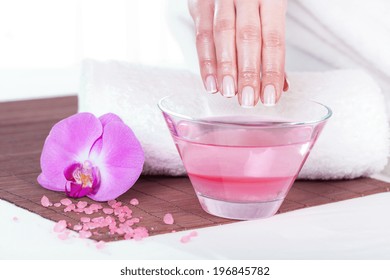 Woman Having Paraffin Hand Treatment In Spa